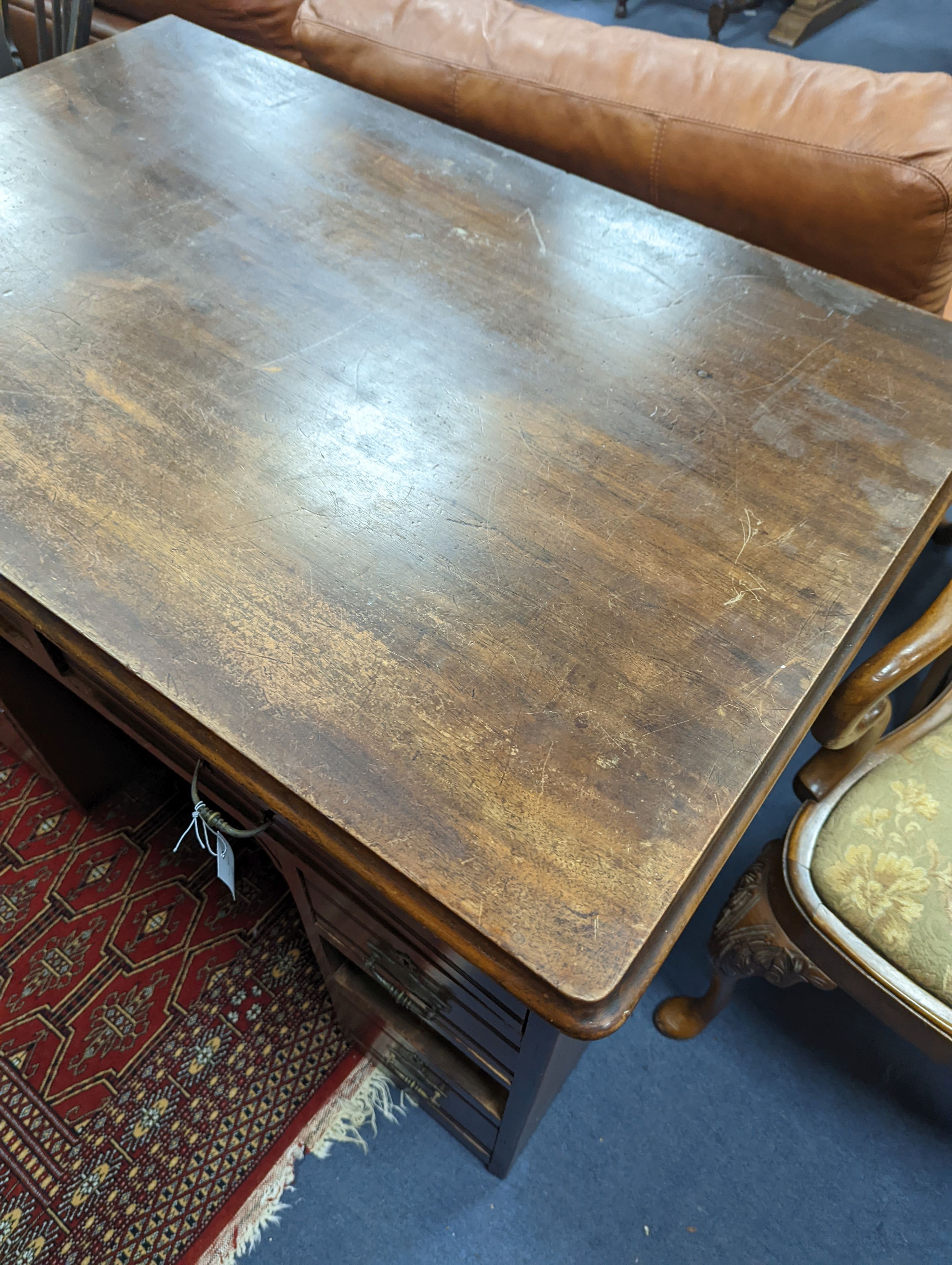A late Victorian mahogany kneehole desk, length 107cm, height 80cm